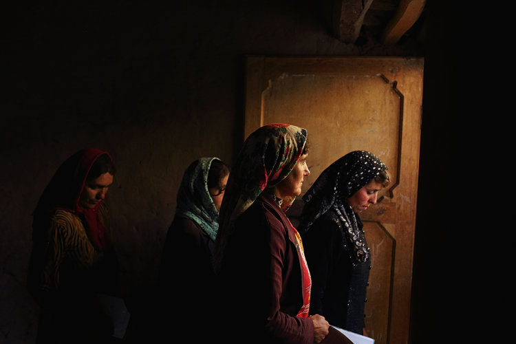  Members of a female Community-Based Savings Group, implemented to enable more independence for women, leave a meeting in the village of Chasnood Bala, north of Shugnan.  Badakhshan Province, May, 2015. 